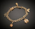 Armband med berlocker i 18 k guld