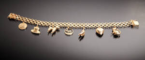 Armband med berlocker i 18 k guld