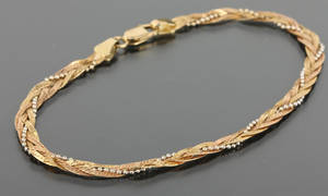 Armbånd af 18 karats guld.