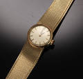 Omega dameur med lænke 18 kt. 750 guld.