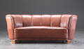 Overpolstret bananformet sofa, læder