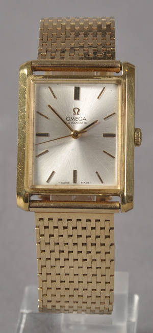 Omega Automatic herreur i 14 kt guld.