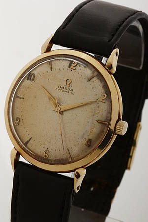Omega vintage herrearmbåndsur af guld med guldkasse af 14 kt. guld. 1950erne