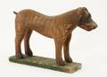 Träskuren och bemålad hund, 1900-talets början