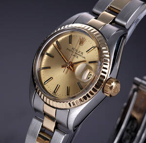 Rolex Datejust. Vintage dameur i 18 kt. guld og stål med champagnefarvet skive, ca. 1979