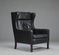 Stouby Møbler. Øreklapstol, sort læder 
