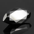 Uindfattet behandlet sort diamant ca. 7.04 ct.