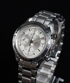 Omega. Herrearmbåndsur, model Speedmaster, boks og papirer