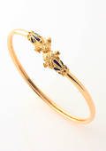 Vintage vædder armring af 18 kt. guld og emalje. 1900tallets første halvdel.