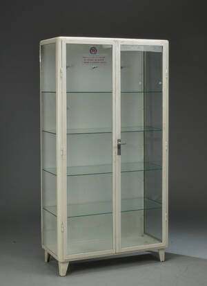 Tandlægeskab af hvidlakeret metal og glas