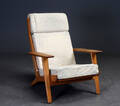 Hans J. Wegner. Højrygget lænestol af egetræ, model GE - 290A