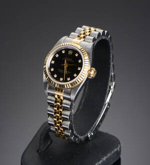 Rolex Oyster Perpetual, damearmbåndsur af guld og stål med diamanter