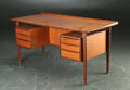 Fritstående skrivebord af teaktræ, 1950erne