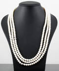 3 strand Cultured fresh water pearl necklace with a silver links