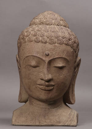 Støbt figur forestillende Buddha ansigt