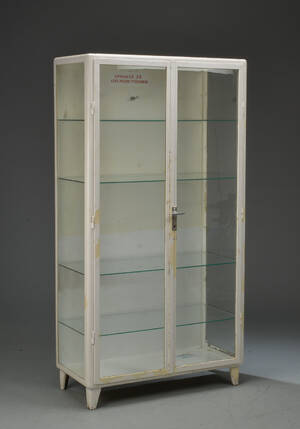 Tandlægeskab af hvidlakeret metal og glas