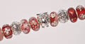 20 Charlotte Borgen beads i røde nuancer 20