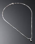 Halskæde med vedhæng i 14 kt hvidguld, prydet med en brillant på ca 0.12 ct
