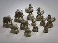 Tolv orientalske lodder af messing og malm, 1900-tallet 12