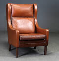 Dansk møbelproducent. Øreklapstol, brunt læder