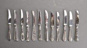 Tolv damefrugtknive af sølv 12